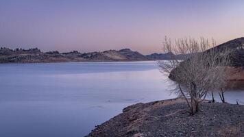 fall or winter dusk over Horsetooth Reservoir at foothills in northern Colorado photo