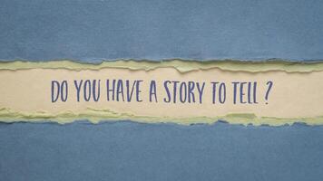 Do you have a story to tell. Handwriting on an art paper. Storytelling and sharing experience. photo