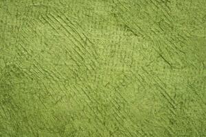 background of green Huun Mayan handmade paper created in Mexico photo