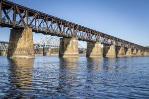 old railroad bridge converted to a footpath - Tennessee River in Florence, Alabama, fall scenery photo