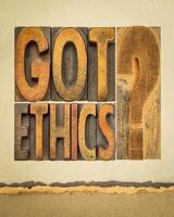 Got ethics. Are you ethical question. Word abstract in vintage letterpress wood type on art paper. photo