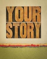 your story - word abstract in vintage letterpress wood type against art paper, storytelling and sharing life experience concept photo