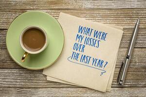 What were my losses over the past year. Self reflection question on a napkin. Review of failures in the past year. photo