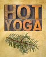 hot yoga word abstract - text in letterpress wood type printing blocks on art paper, vertical poster photo