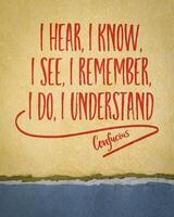 I hear, I know. I see, I remember, I do, I understand. - Confucius quote on a art paper, experiential learning and the progression of understanding through different sensory experiences. photo