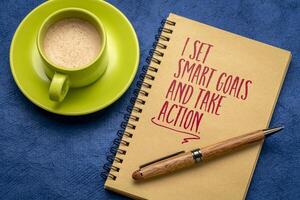 I set smart goals and take action, positive affirmation note in a notebook, goal setting and personal development concept photo