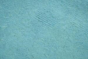 background of blue Huun Mayan handmade paper created in Mexico photo