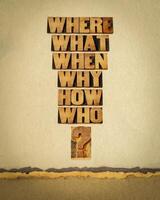 who, what, where, when, why, how questions  - brainstorming or decision making concept - words in vintage letterpress wood type against art paper photo