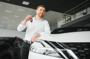 Man buying a car at a showroom photo