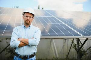 confident man and power solar station photo