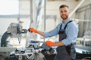 Factory worker. Man working on the production line. photo