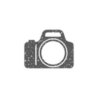 Camera icon in grunge texture vector illustration