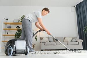 Middle-aged woman cleaning new apartment. photo