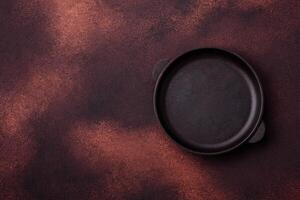 Empty ceramic round plate on dark textured concrete background photo