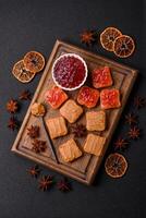 Delicious nutritious sandwiches with peanut butter, strawberry jam photo