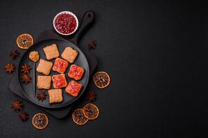 Delicious nutritious sandwiches with peanut butter, strawberry jam photo