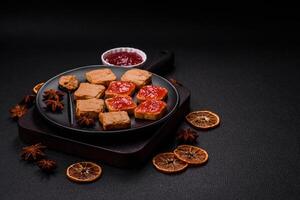 Delicious nutritious sandwiches with peanut butter, strawberry jam photo