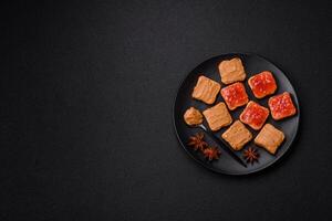 Delicious nutritious sandwiches with peanut butter, strawberry jam photo