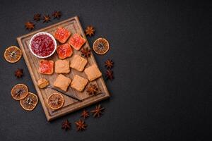 Delicious nutritious sandwiches with peanut butter, strawberry jam photo