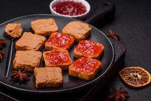 Delicious nutritious sandwiches with peanut butter, strawberry jam photo