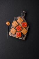 Delicious nutritious sandwiches with peanut butter, strawberry jam photo