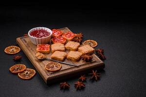 Delicious nutritious sandwiches with peanut butter, strawberry jam photo