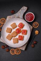 Delicious nutritious sandwiches with peanut butter, strawberry jam photo