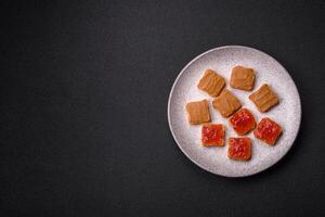 Delicious nutritious sandwiches with peanut butter, strawberry jam photo