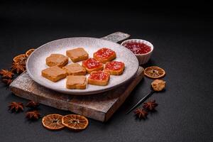Delicious nutritious sandwiches with peanut butter, strawberry jam photo