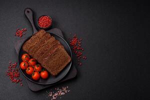 Delicious brown bread with seeds and grains cut into slices photo