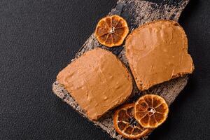 Delicious hearty sandwich with toast bread and peanut butter photo