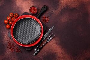 Empty ceramic round plate on dark textured concrete background photo