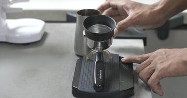 weighing ground coffee with a digital scale video