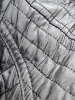 Raincoat fabric. Stitched raincoat fabric. Background with raincoat fabric photo