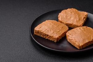 Delicious hearty sandwich with toast bread and peanut butter photo