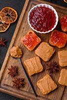 Delicious nutritious sandwiches with peanut butter, strawberry jam photo