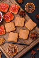 Delicious nutritious sandwiches with peanut butter, strawberry jam photo