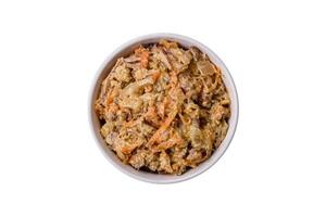 Delicious boiled beef or pork tongue sliced with carrots, onions, sour cream and spices photo