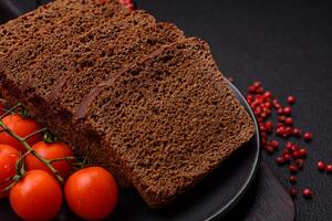 Delicious brown bread with seeds and grains cut into slices photo