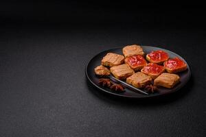 Delicious nutritious sandwiches with peanut butter, strawberry jam photo