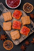 Delicious nutritious sandwiches with peanut butter, strawberry jam photo