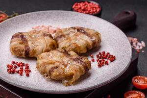 Round minced chicken or pork cutlet wrapped in bacon with salt, spices and herbs photo