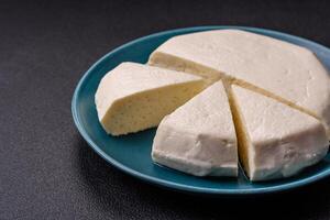 Delicious fresh white young cheese from cow's or sheep's milk photo