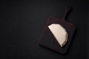 Delicious fresh white young cheese from cow's or sheep's milk photo