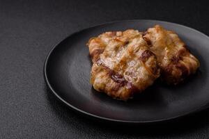 Round minced chicken or pork cutlet wrapped in bacon with salt, spices and herbs photo