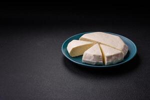 Delicious fresh white young cheese from cow's or sheep's milk photo