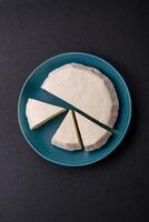 Delicious fresh white young cheese from cow's or sheep's milk photo