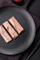 Delicious canned dietary tuna meat with salt, spices and oil photo