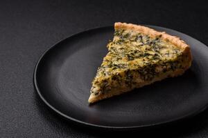 Delicious crispy quiche cut into slices with cheese, broccoli, tomatoes photo