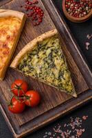 Delicious crispy quiche cut into slices with cheese, broccoli, tomatoes photo
